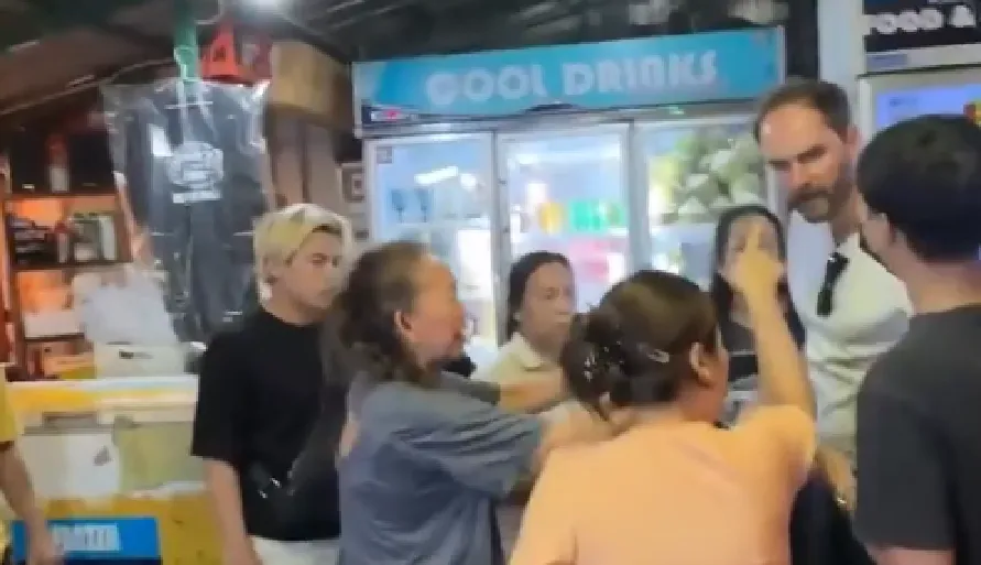 Tourist arguing in Bangkok riverside bar